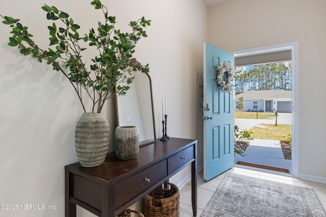 foyer entrance with light tile patterned floors