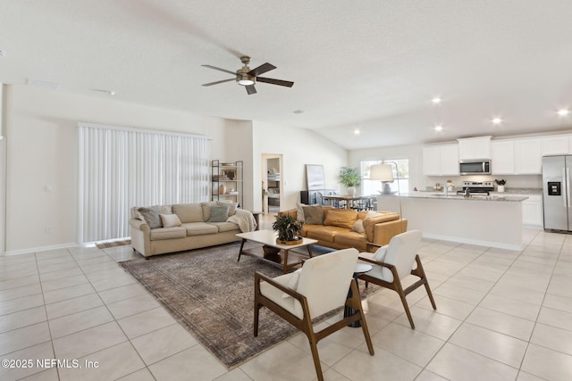 living room with light tile patterned floors, a textured ceiling, recessed lighting, a ceiling fan, and vaulted ceiling