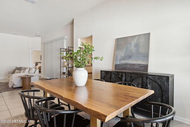 dining area with visible vents, baseboards, and light tile patterned flooring