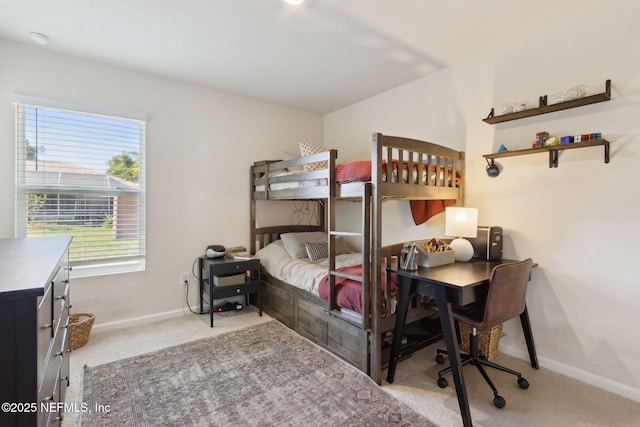 carpeted bedroom with baseboards