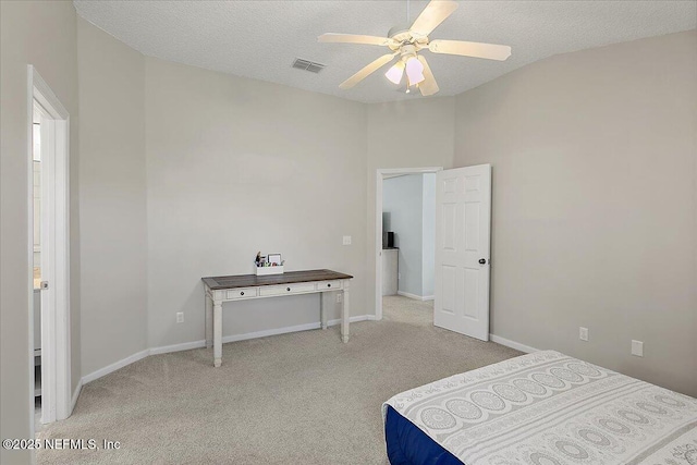 bedroom with baseboards, visible vents, ceiling fan, carpet, and a textured ceiling