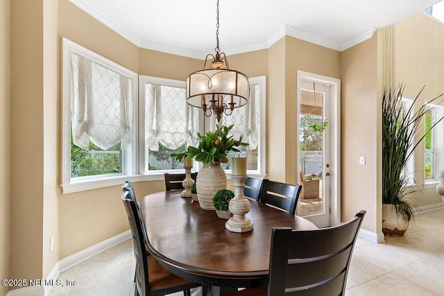 dining space featuring plenty of natural light and crown molding