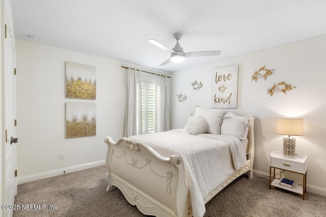 bedroom with carpet floors, a ceiling fan, and baseboards