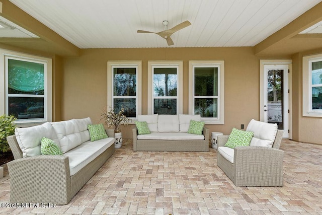 view of patio with outdoor lounge area and a ceiling fan