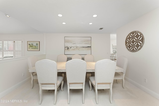 dining area with baseboards, light colored carpet, visible vents, and recessed lighting