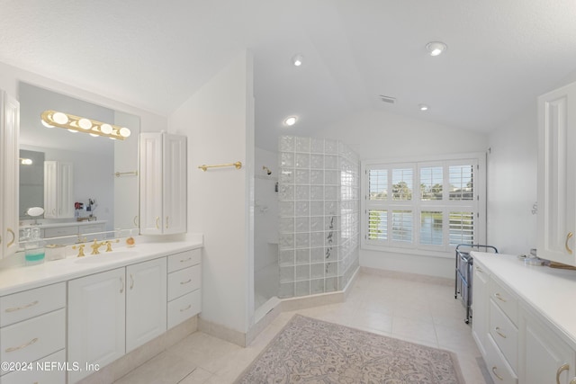 full bathroom featuring lofted ceiling, recessed lighting, vanity, tile patterned floors, and walk in shower