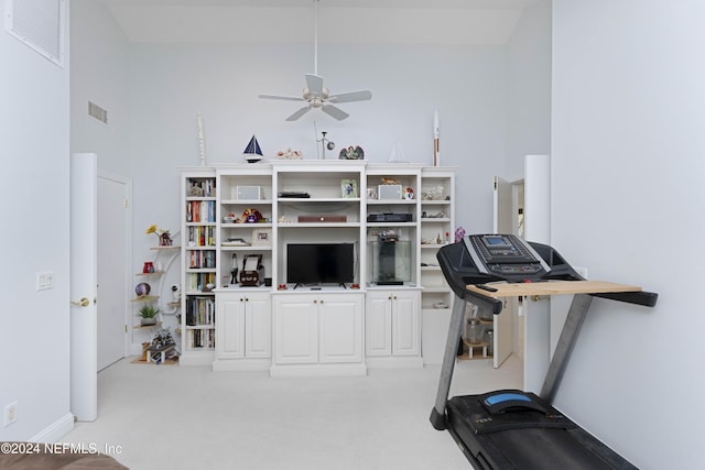 exercise area with visible vents and ceiling fan