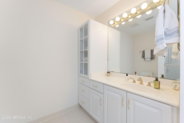 bathroom with baseboards, visible vents, toilet, tile patterned floors, and vanity