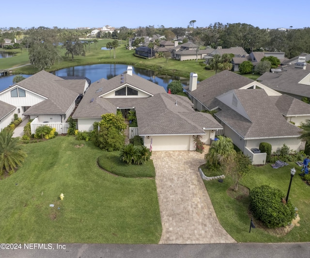 drone / aerial view with a residential view and a water view