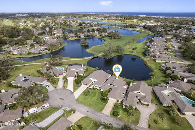 bird's eye view with a residential view and a water view