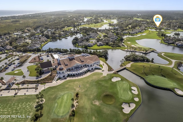 bird's eye view featuring golf course view and a water view