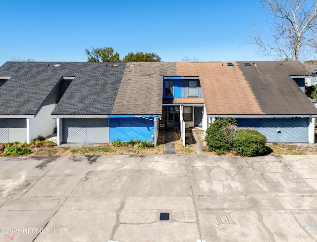 view of front of home with roof with shingles