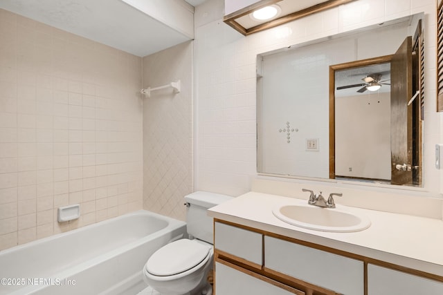 full bathroom with ceiling fan, bathing tub / shower combination, vanity, and toilet