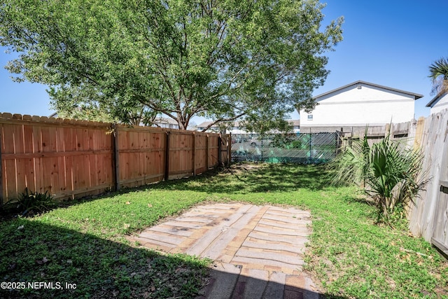 view of yard featuring a fenced backyard