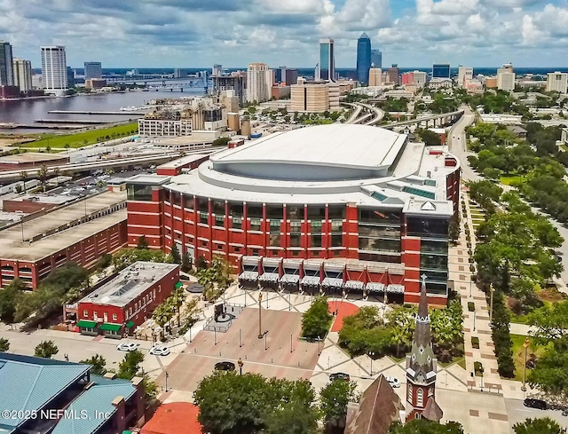 birds eye view of property featuring a view of city and a water view