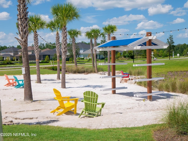 view of property's community with a lawn