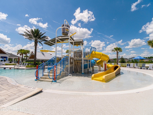 community playground featuring a water play area and a community pool