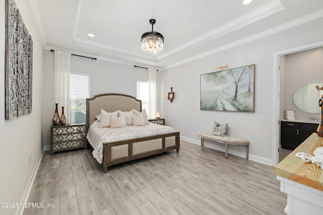 bedroom featuring a raised ceiling, crown molding, light wood-style floors, and baseboards