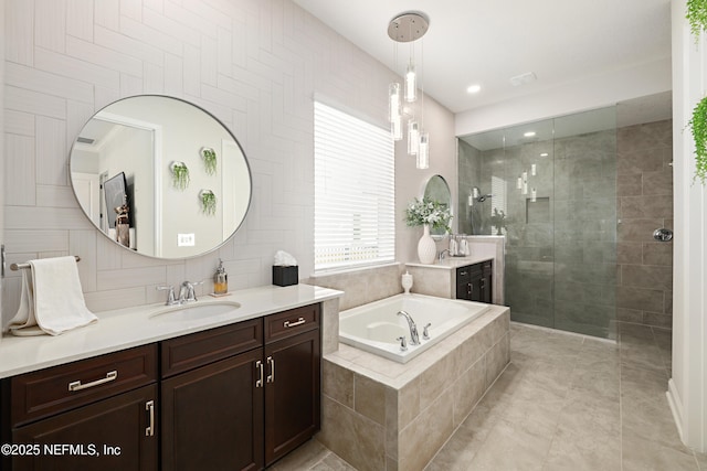 full bathroom with vanity, a garden tub, a walk in shower, and decorative backsplash