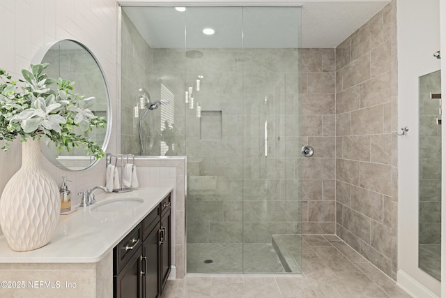 bathroom with vanity and walk in shower