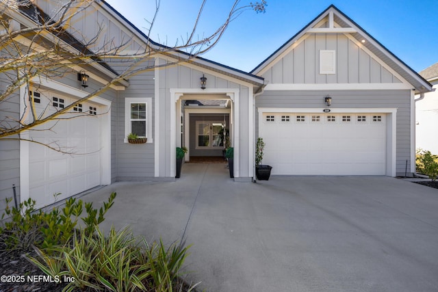 view of front facade featuring concrete driveway, an attached garage, and board and batten siding