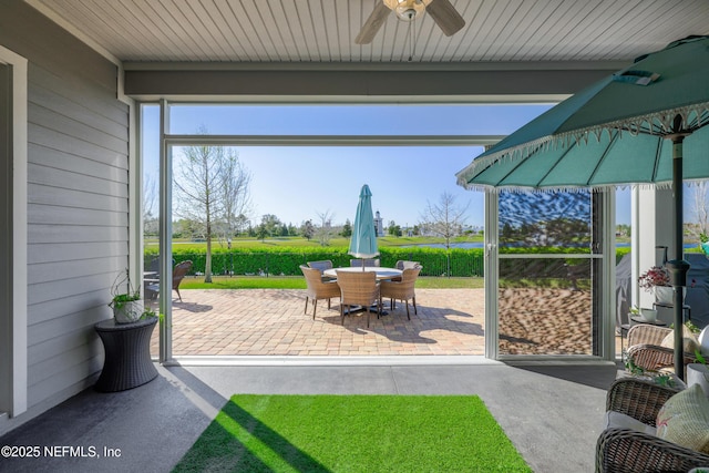 view of patio / terrace featuring outdoor dining space and a ceiling fan