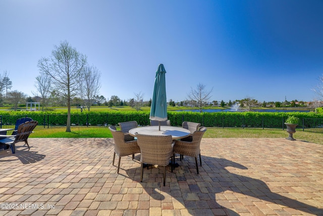 view of patio / terrace with outdoor dining space and fence