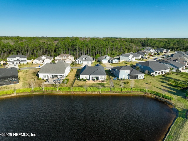 birds eye view of property featuring a residential view and a water view