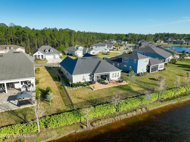 aerial view featuring a residential view and a water view