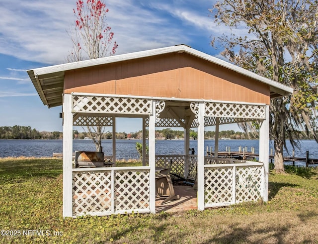 exterior space with a water view and a gazebo