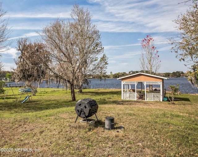 view of yard featuring a water view and a gazebo