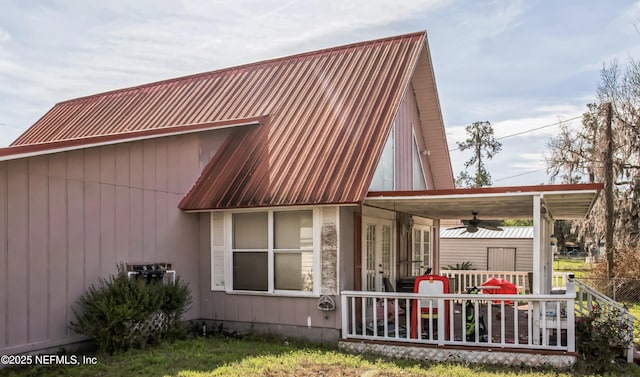 view of side of home with a porch