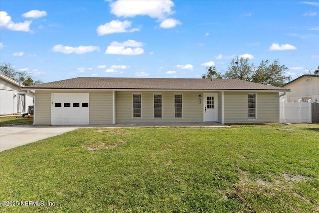 ranch-style house featuring driveway, a front lawn, an attached garage, and fence