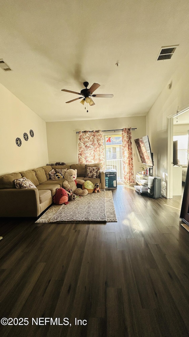 unfurnished living room featuring ceiling fan, wood finished floors, and visible vents