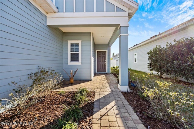 entrance to property featuring board and batten siding