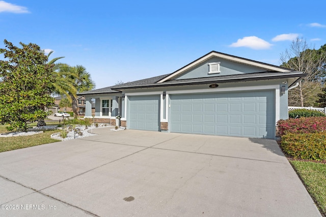 ranch-style home with a garage, driveway, and stucco siding