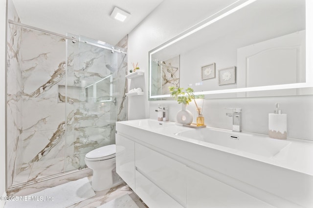 bathroom featuring a sink, a marble finish shower, toilet, and marble finish floor