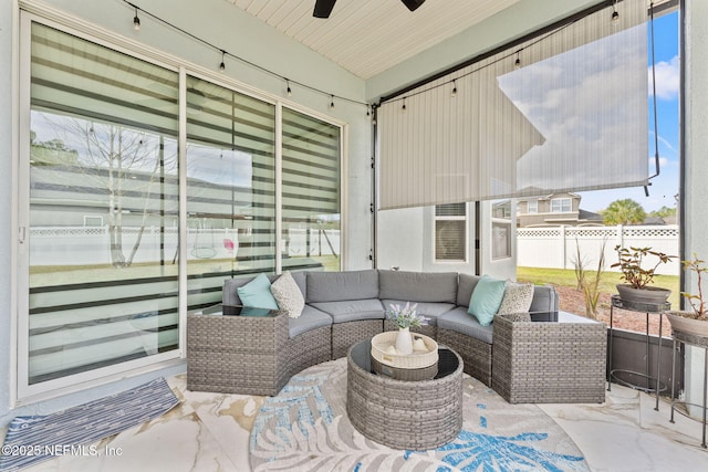 view of patio featuring an outdoor living space, ceiling fan, and fence