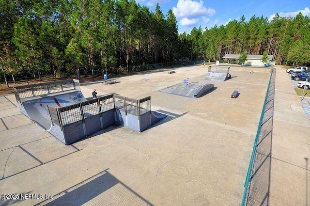 view of swimming pool featuring a gate and fence