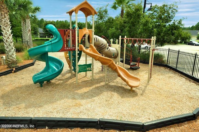 communal playground featuring fence