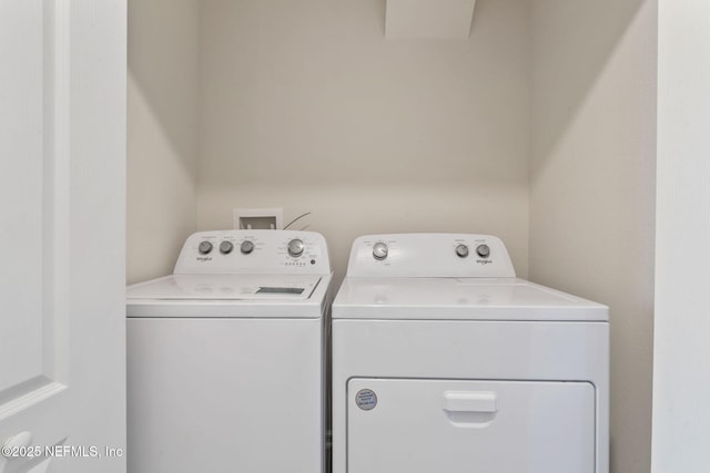 washroom with separate washer and dryer