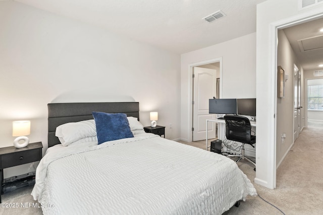 bedroom with light carpet, baseboards, visible vents, and attic access