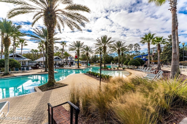 community pool featuring a patio area