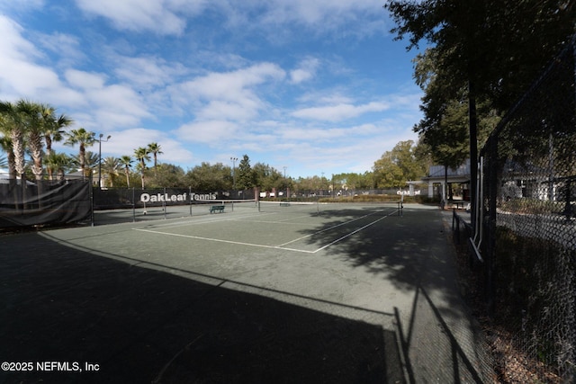 view of sport court with fence