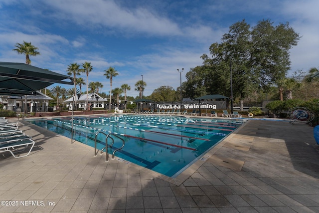 community pool with a patio