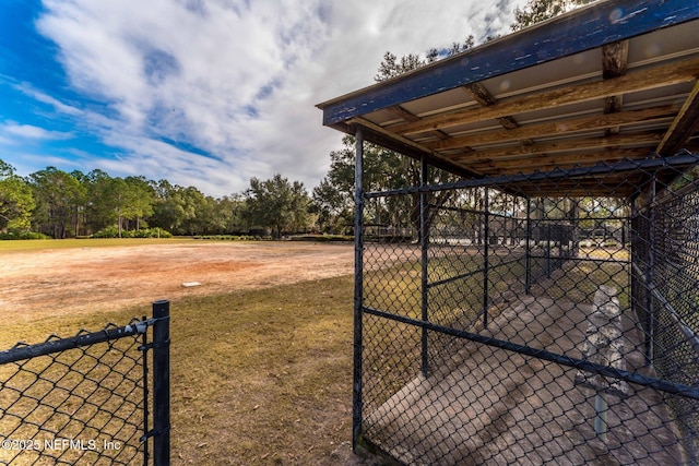 exterior space with a gate and fence