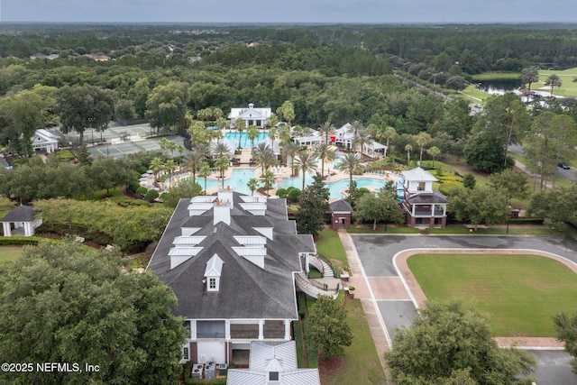 drone / aerial view featuring a forest view