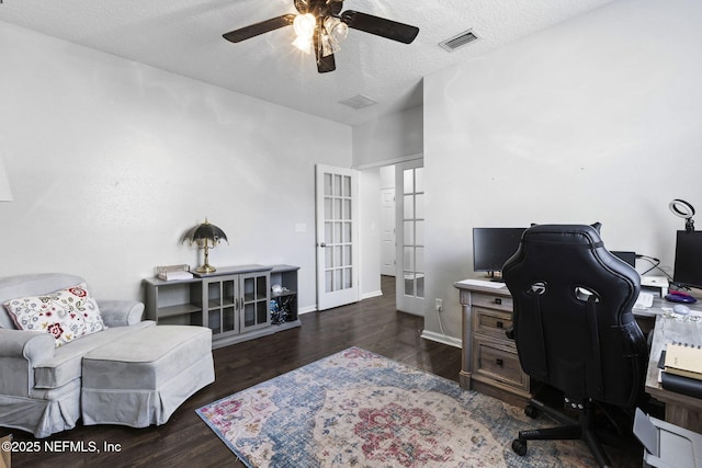 office space featuring visible vents, ceiling fan, french doors, wood finished floors, and a textured ceiling