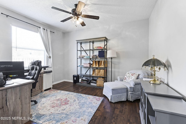 office area featuring a textured ceiling, wood finished floors, baseboards, and ceiling fan