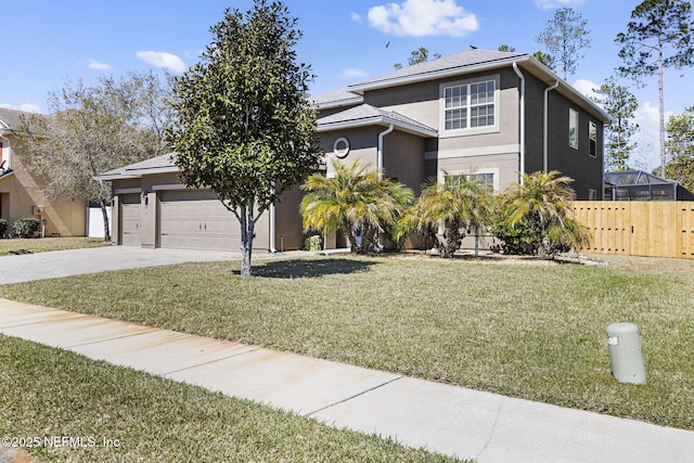 view of front of property featuring a front lawn, fence, stucco siding, a garage, and driveway